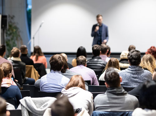 speaker-giving-talk-conference-hall-business-event-audience-conference-hall