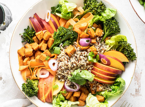 sweet-potato-buddha-bowl-white-table-flat-lay